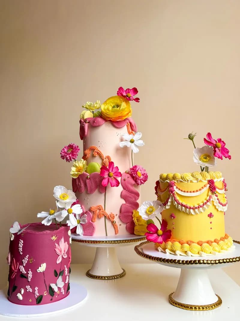 Three bright floral celebration cakes