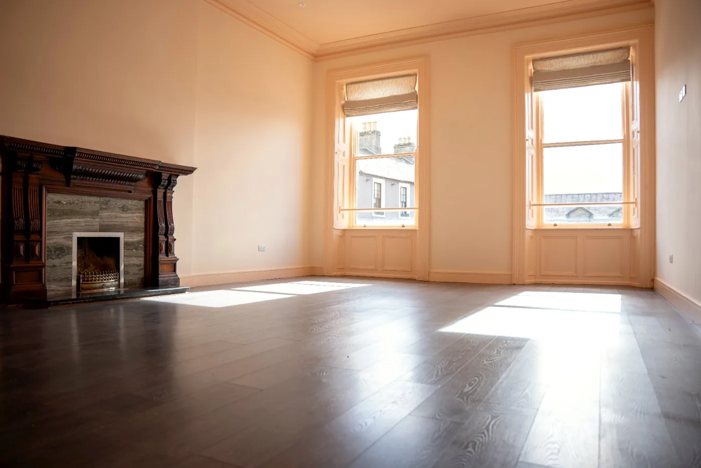 The Market Studio: a bright empty room with a fireplace